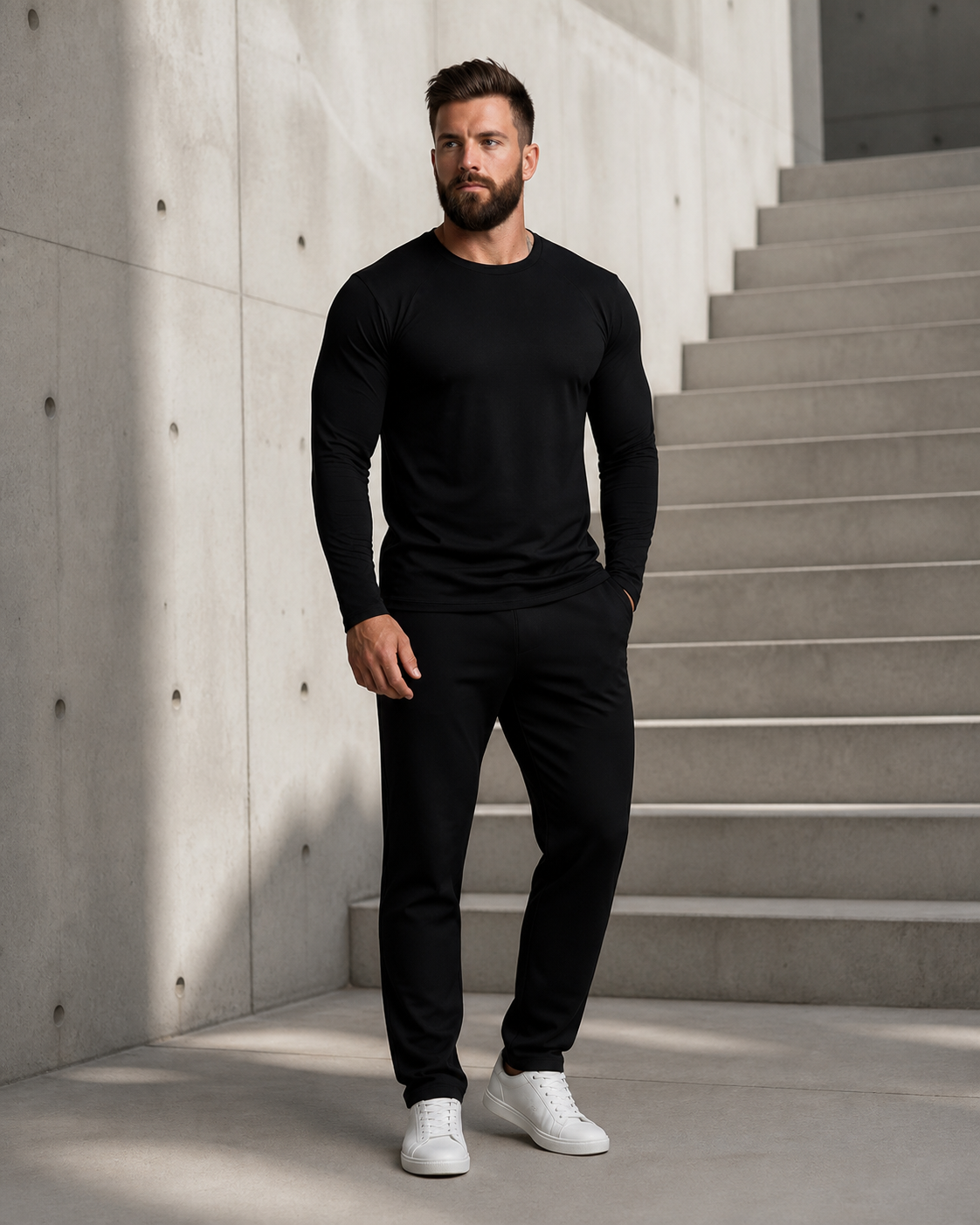 Model wearing the black Averon FitFlex Long in a modern architectural setting