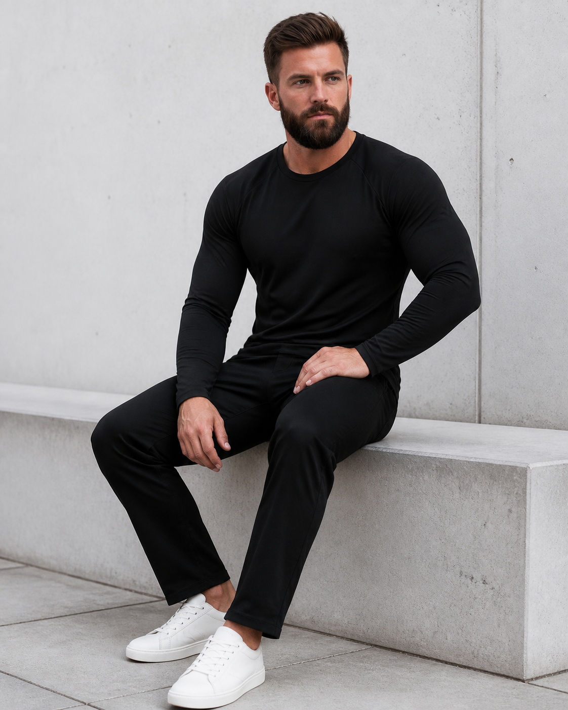 Seated model wearing the black Averon FitFlex Long